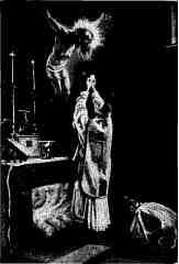 image of a Priest offering the Sacred Host at the Altar, with the True but Mystical presence of Jesus crucified before the Priest